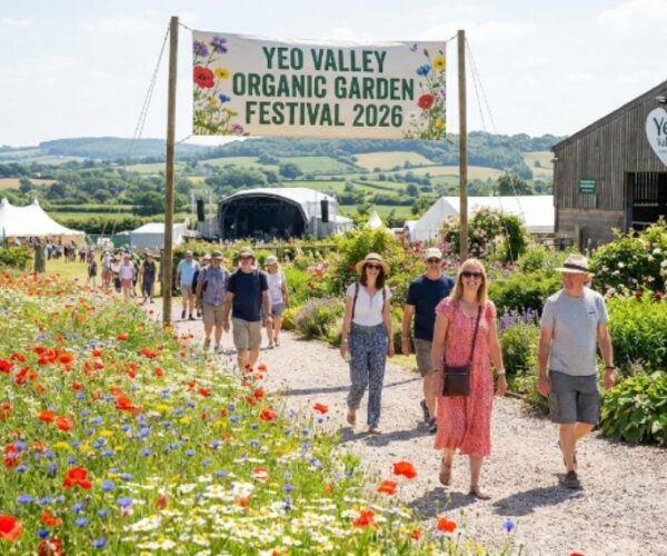 Visitors walking through the six-and-a-half acres of organic-certified Yeo Valley garden in Blagdon, Somerset, surrounded by wildflower meadows and lush borders during the 2026 festival