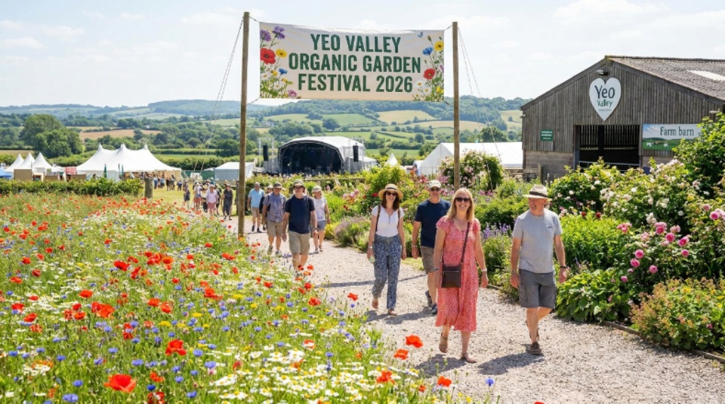 Visitors walking through the six-and-a-half acres of organic-certified Yeo Valley garden in Blagdon, Somerset, surrounded by wildflower meadows and lush borders during the 2026 festival