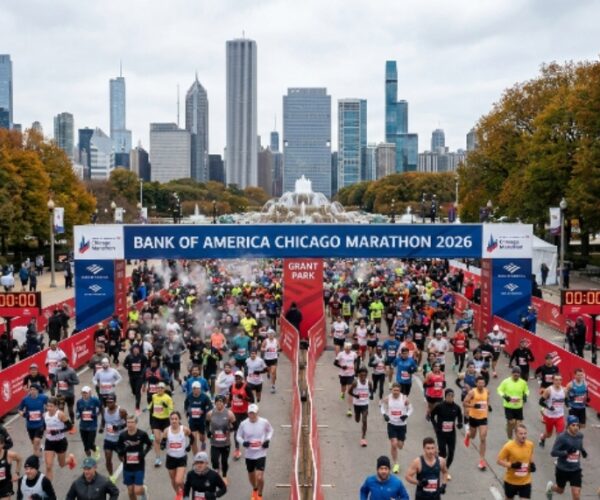 Tens of thousands of runners crossing the start line at the Bank of America Chicago Marathon 2026 in Grant Park, Chicago, on a cool October morning